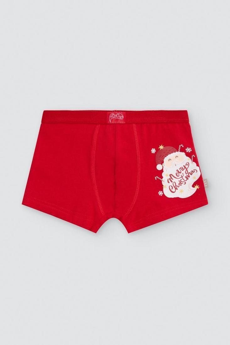 Bóxer infantil rojo con cintura elástica y estampado lateral de Papá Noel con el mensaje Merry Christmas.
