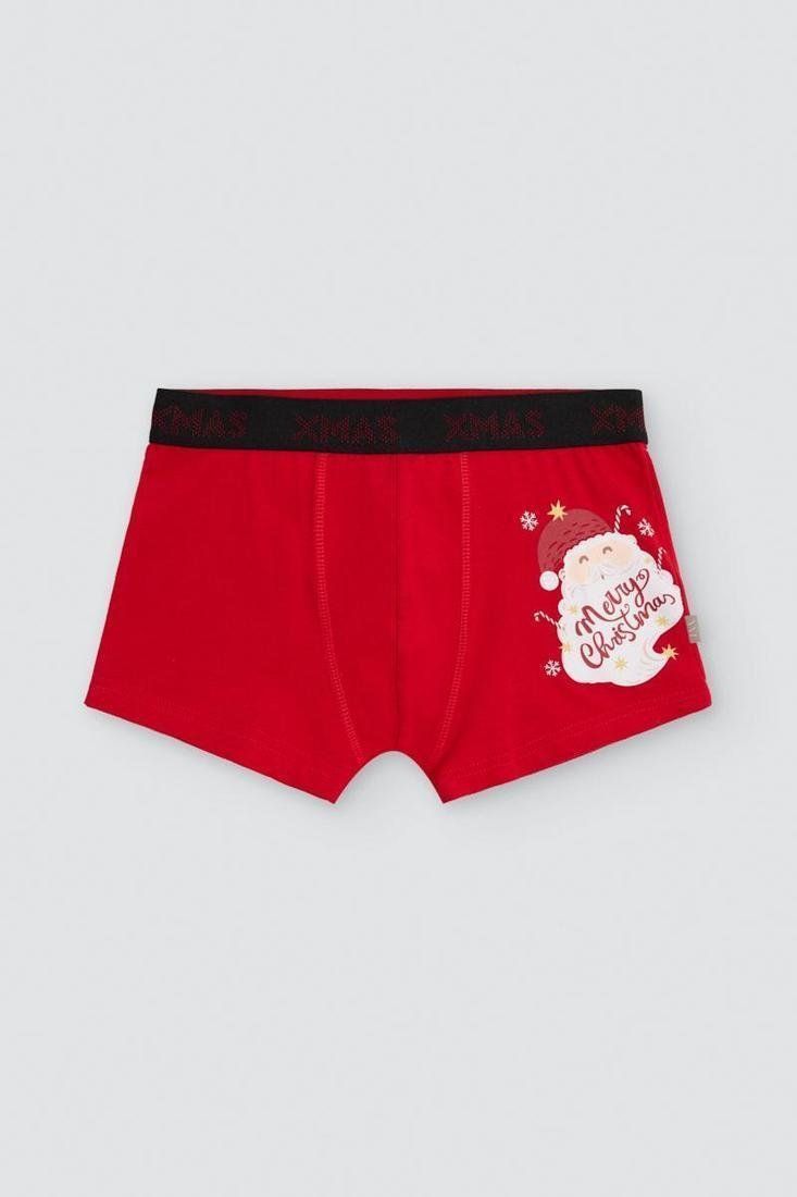 Bóxer juvenil rojo con cintura elástica negra y estampado lateral de Papá Noel con el mensaje Merry Christmas.