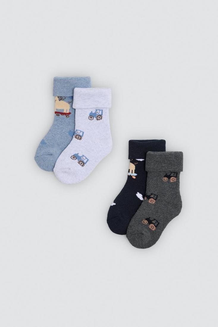 Calcetines térmicos de bebé Ysabel Mora 52910 en azul, gris claro, azul marino y gris oscuro, con dibujos de cerditos y tractores.